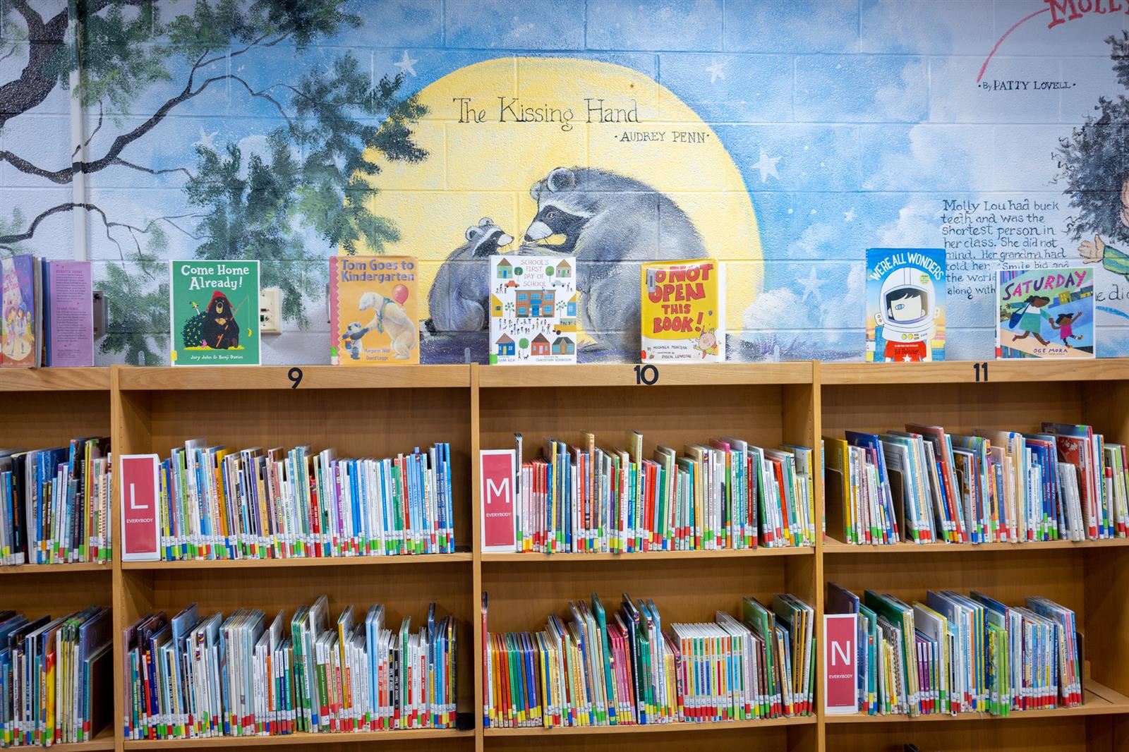 The Kissing Hand painted wall in a library